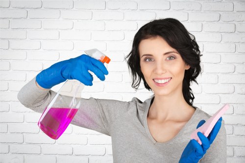 High-touch surfaces being sanitized in a shared corridor