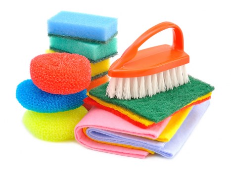 Airbnb cleaner sanitizing kitchen counters and appliances
